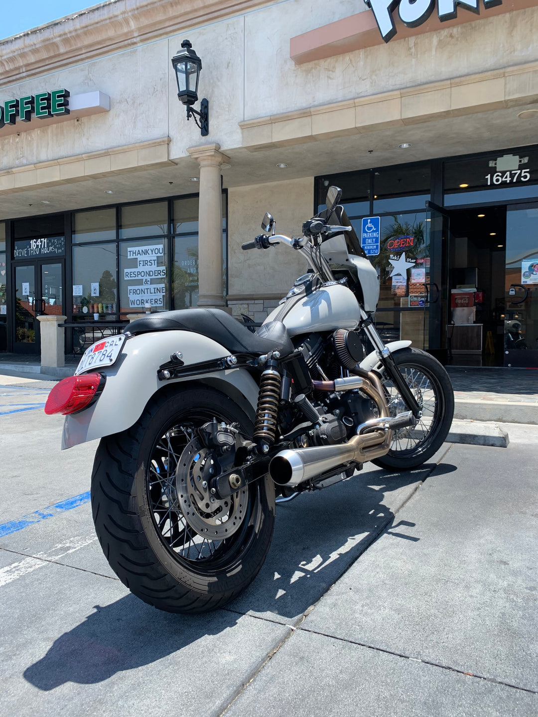A Harley Dyna parked with an RWD V-Twin rear fender installed