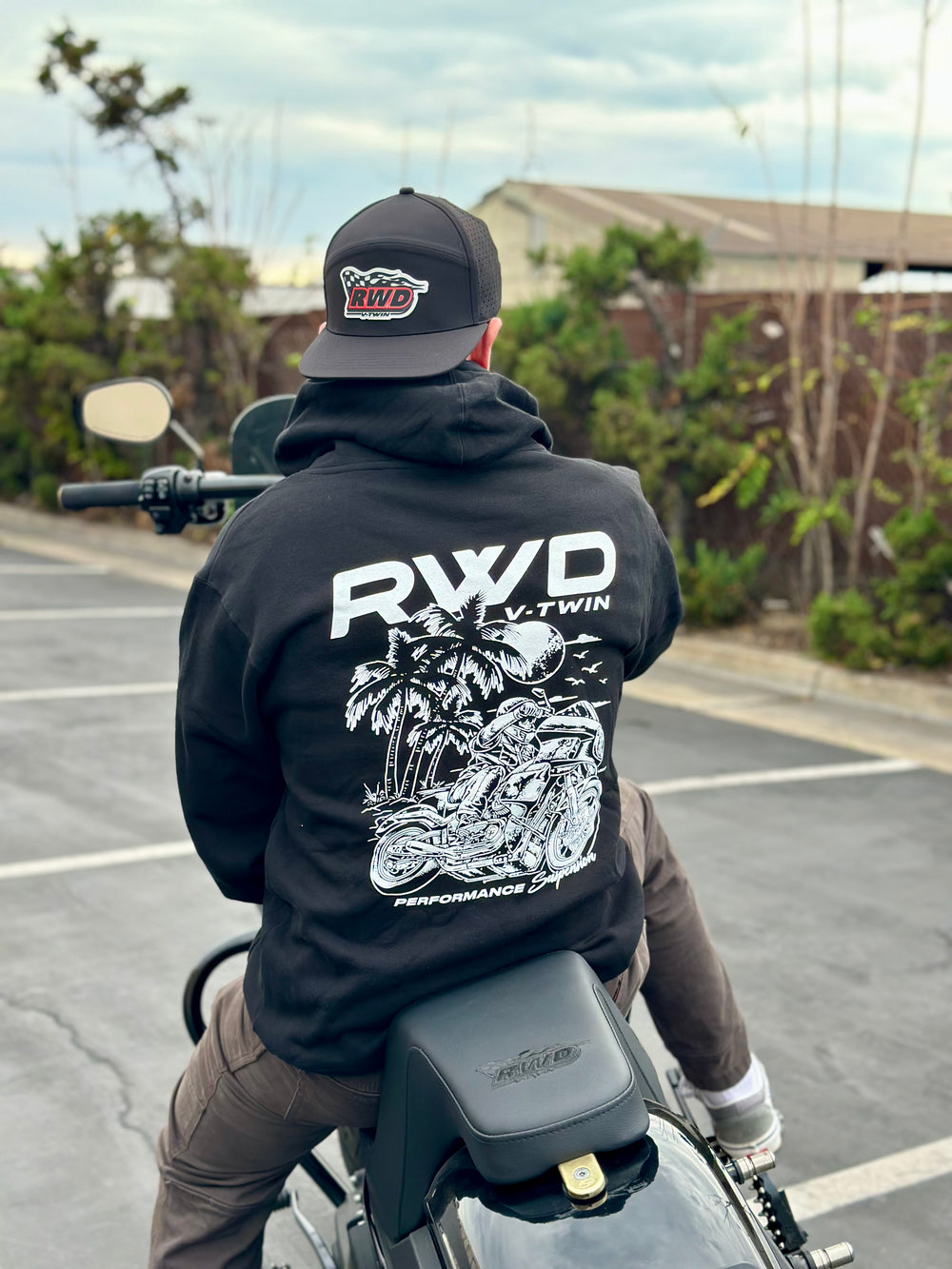 Man wearing an RWD V-Twin hat backwards and an RWD sweatshirt