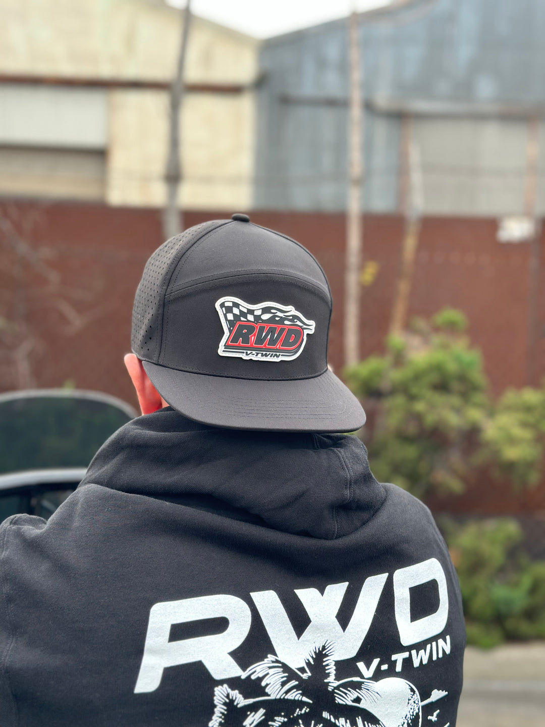 Man wearing an RWD V-Twin hat backwards and an RWD sweatshirt